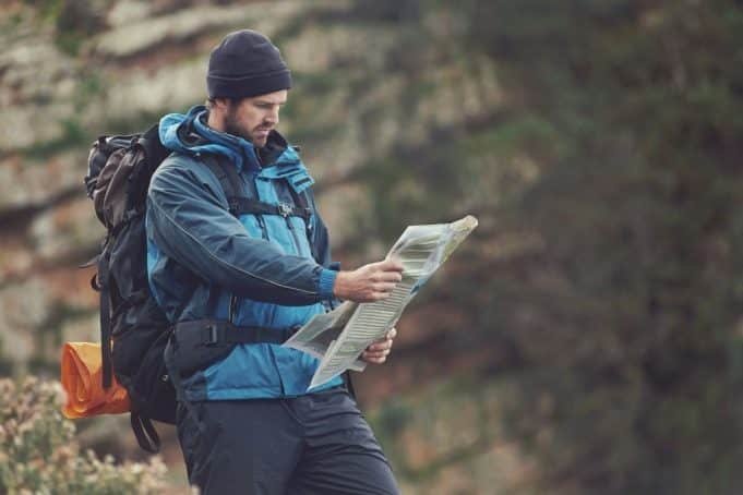 you are hiking into unfamiliar terrain. What is the best way to keep your bearings